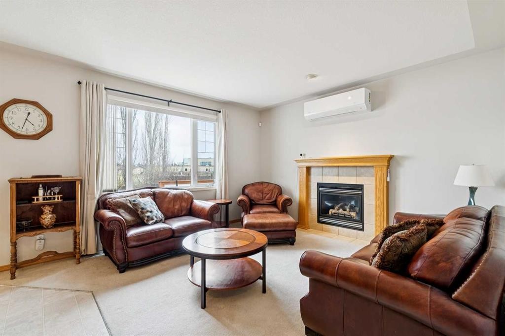 37 Cimarron Trail, Okotoks, AB - Indoor Photo Showing Living Room With Fireplace