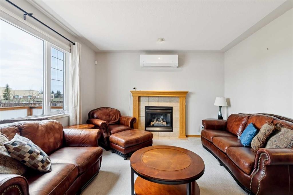 37 Cimarron Trail, Okotoks, AB - Indoor Photo Showing Living Room With Fireplace