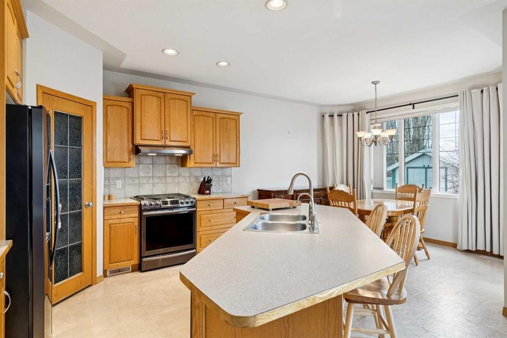 37 Cimarron Trail, Okotoks, AB - Indoor Photo Showing Kitchen With Double Sink