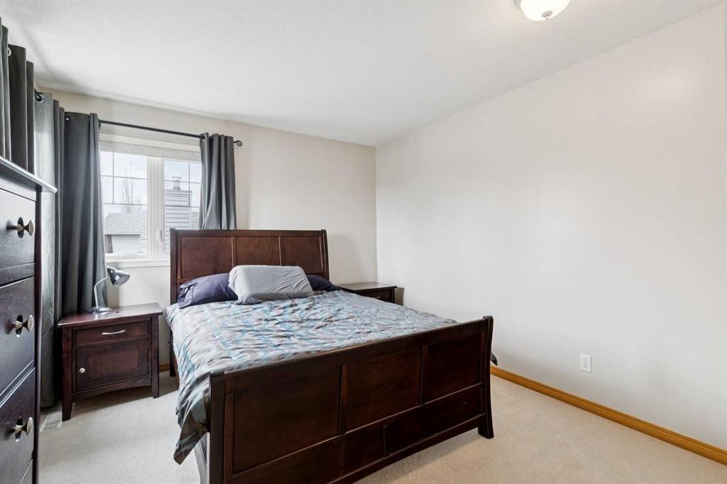 37 Cimarron Trail, Okotoks, AB - Indoor Photo Showing Bedroom