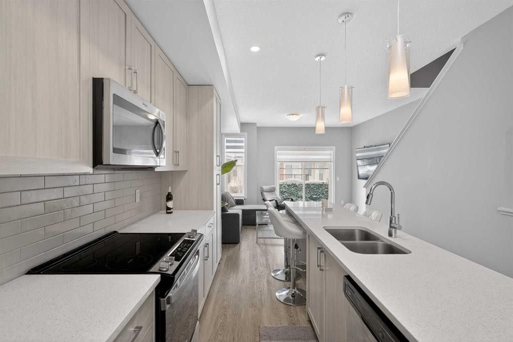 930 Sage Hill Grove Nw, Calgary, AB - Indoor Photo Showing Kitchen With Double Sink With Upgraded Kitchen