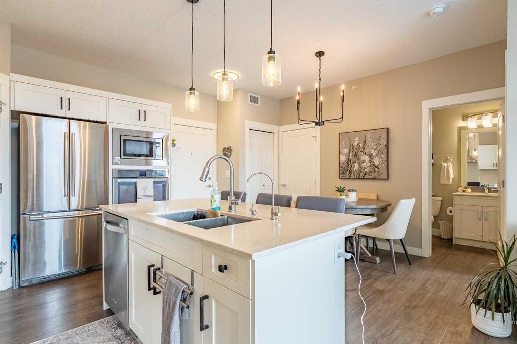 412-10 Walgrove Walk Se, Calgary, AB - Indoor Photo Showing Kitchen With Stainless Steel Kitchen With Double Sink With Upgraded Kitchen