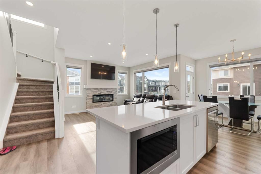 7 Corner Glen Common Ne, Calgary, AB - Indoor Photo Showing Kitchen With Fireplace With Double Sink With Upgraded Kitchen