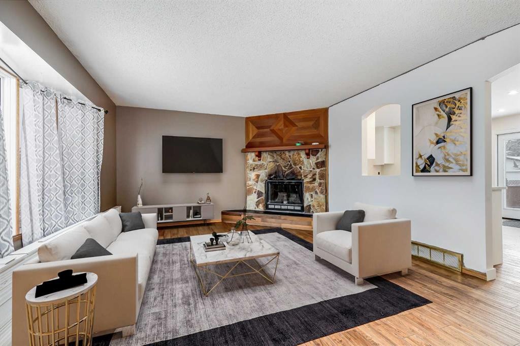 41 Alpine Crescent Se, Airdrie, AB - Indoor Photo Showing Living Room With Fireplace