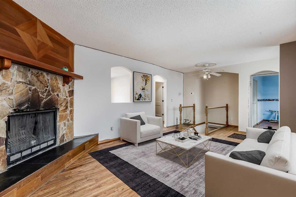 41 Alpine Crescent Se, Airdrie, AB - Indoor Photo Showing Living Room With Fireplace