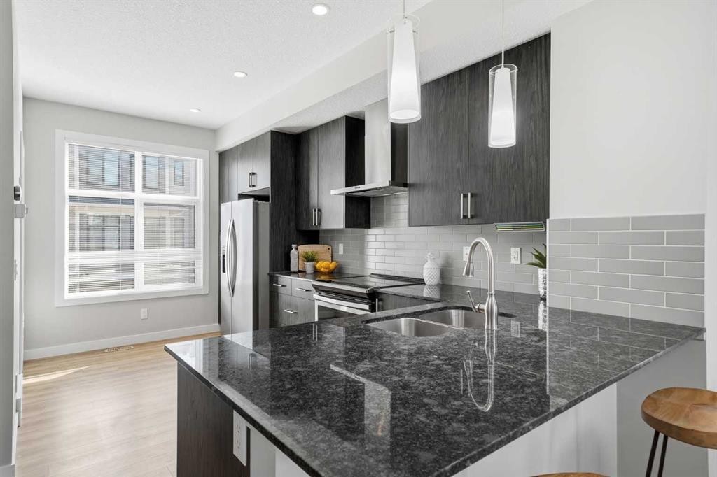4135 Seton Drive Se, Calgary, AB - Indoor Photo Showing Kitchen With Double Sink With Upgraded Kitchen