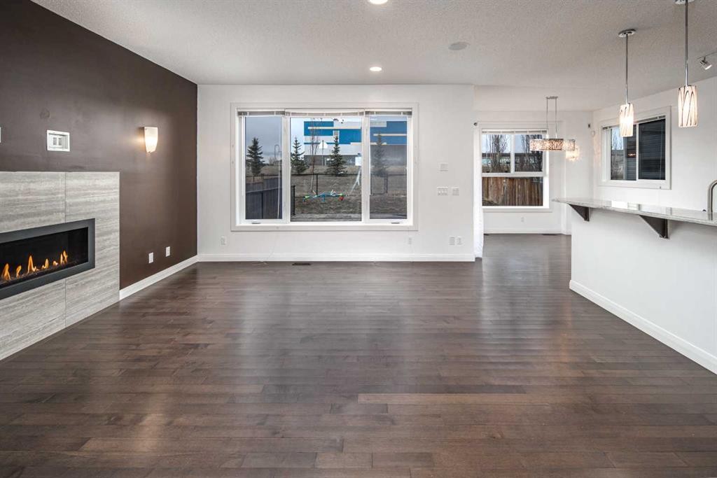 238 Silverado Plains Circle Sw, Calgary, AB - Indoor Photo Showing Living Room With Fireplace