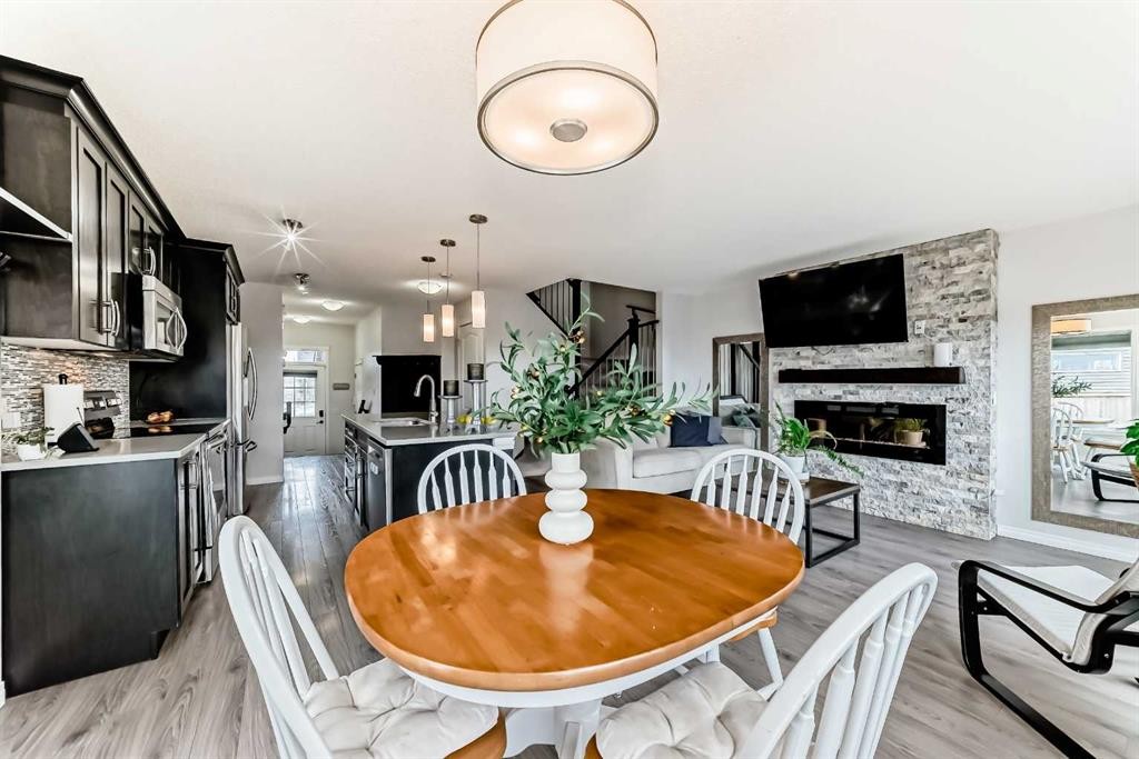289 Auburn Meadows Place Se, Calgary, AB - Indoor Photo Showing Dining Room With Fireplace