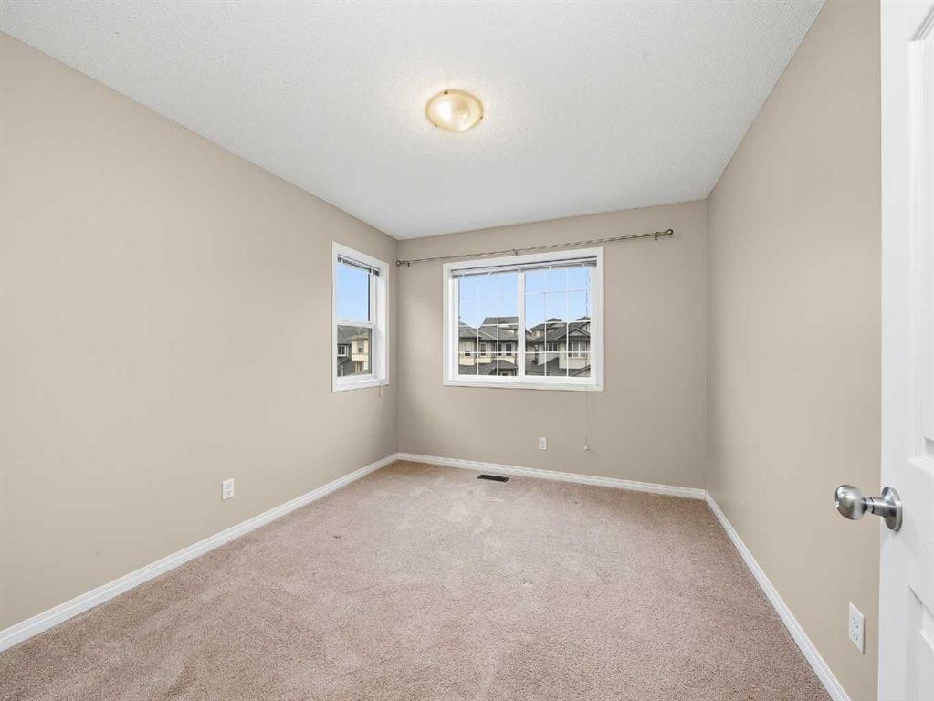 32 Panatella Parade Nw, Calgary, AB - Indoor Photo Showing Other Room