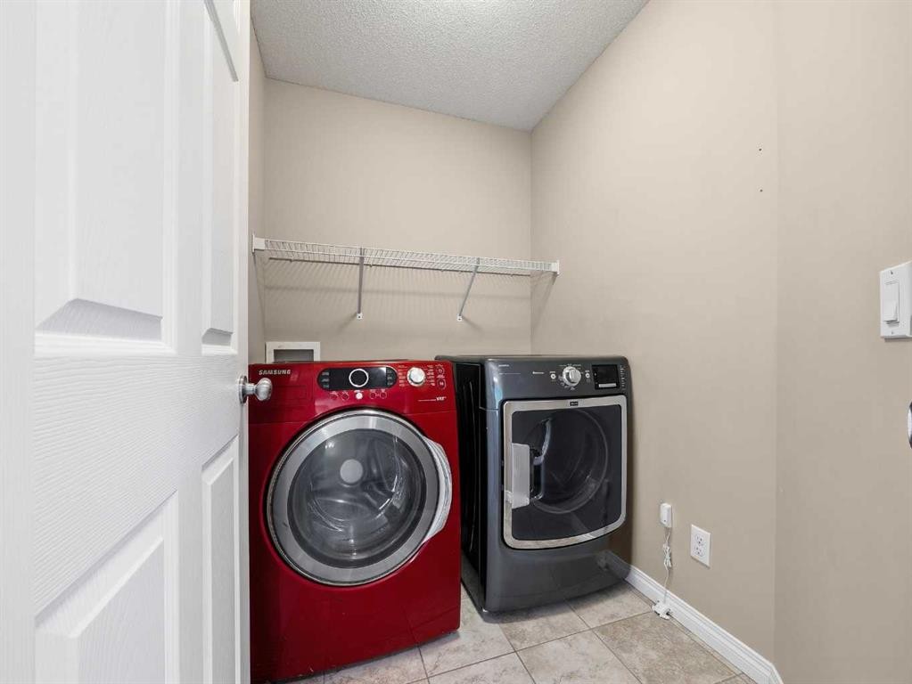 32 Panatella Parade Nw, Calgary, AB - Indoor Photo Showing Laundry Room