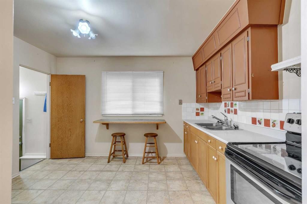 604 56 Avenue Sw, Calgary, AB - Indoor Photo Showing Kitchen With Double Sink