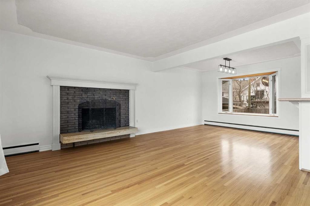 67 Hooke Road Sw, Calgary, AB - Indoor Photo Showing Living Room With Fireplace