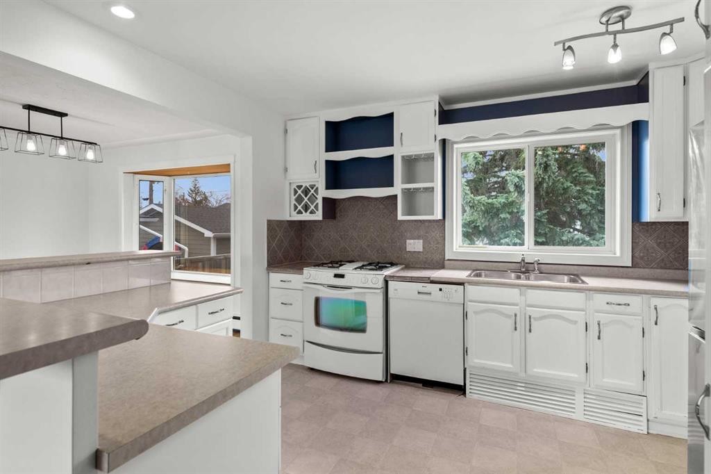 67 Hooke Road Sw, Calgary, AB - Indoor Photo Showing Kitchen With Double Sink