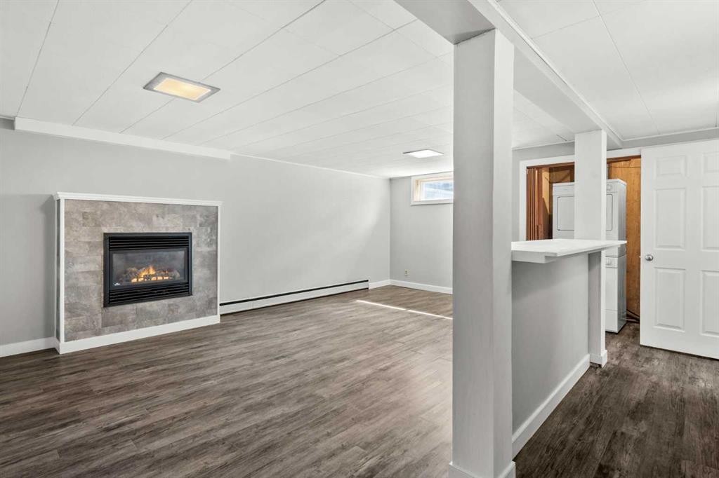67 Hooke Road Sw, Calgary, AB - Indoor With Fireplace