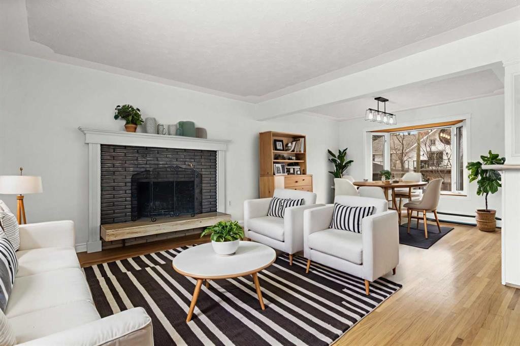 67 Hooke Road Sw, Calgary, AB - Indoor Photo Showing Living Room With Fireplace