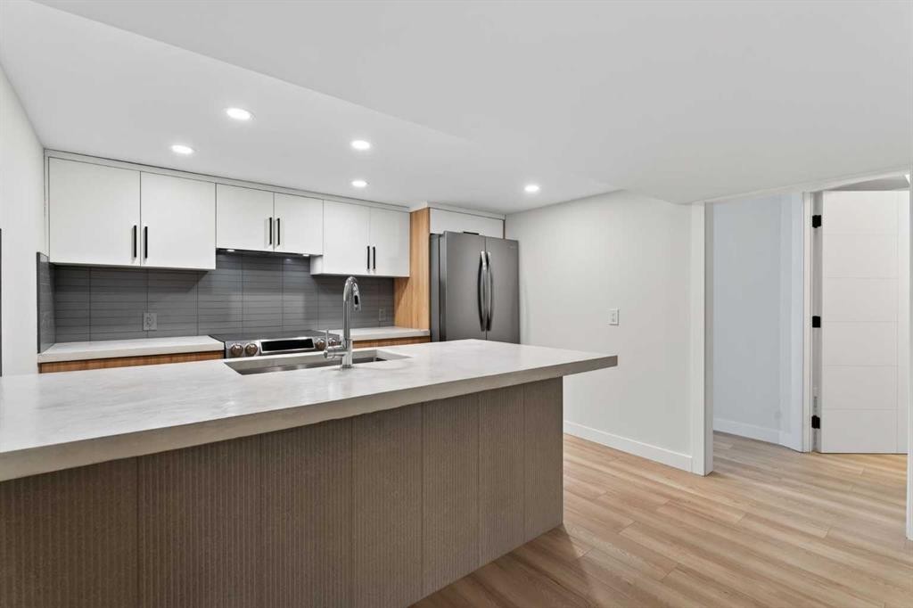 42 Sunvista Crescent Se, Calgary, AB - Indoor Photo Showing Kitchen With Double Sink