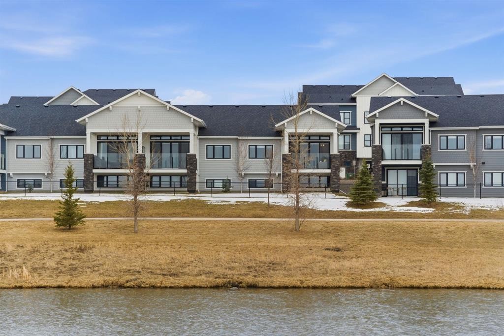 408 Crestridge Common Sw, Calgary, AB - Outdoor With Body Of Water With Deck Patio Veranda With Facade