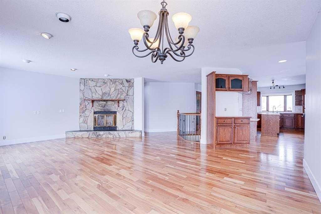264201 Range Road 12 Sw, Airdrie, AB - Indoor Photo Showing Living Room With Fireplace