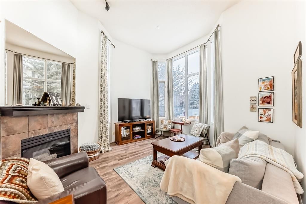 424 Hawkstone Manor Nw, Calgary, AB - Indoor Photo Showing Living Room With Fireplace