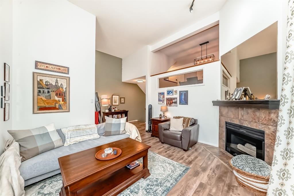424 Hawkstone Manor Nw, Calgary, AB - Indoor Photo Showing Living Room With Fireplace
