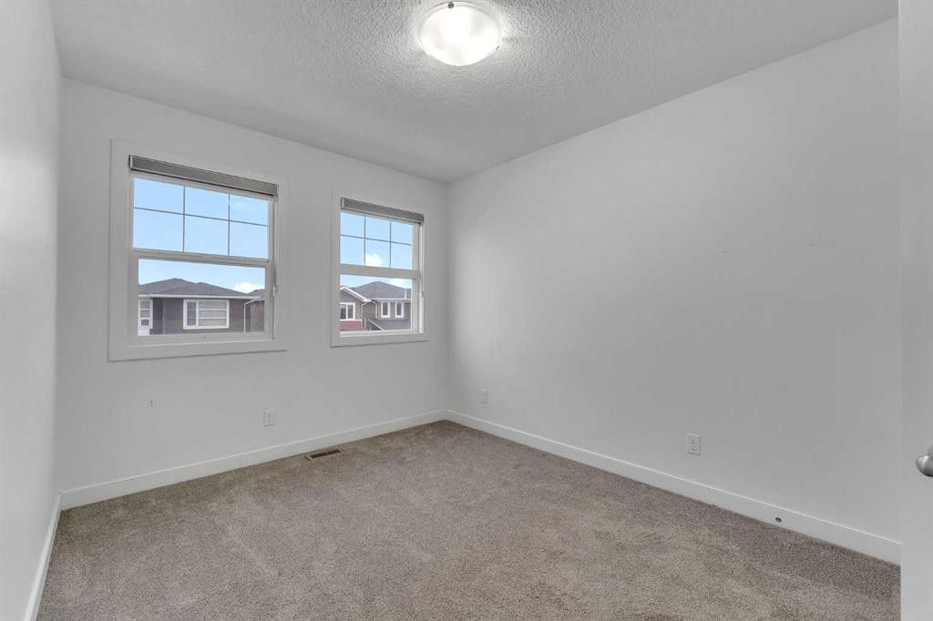 9 Redstone Common Ne, Calgary, AB - Indoor Photo Showing Other Room