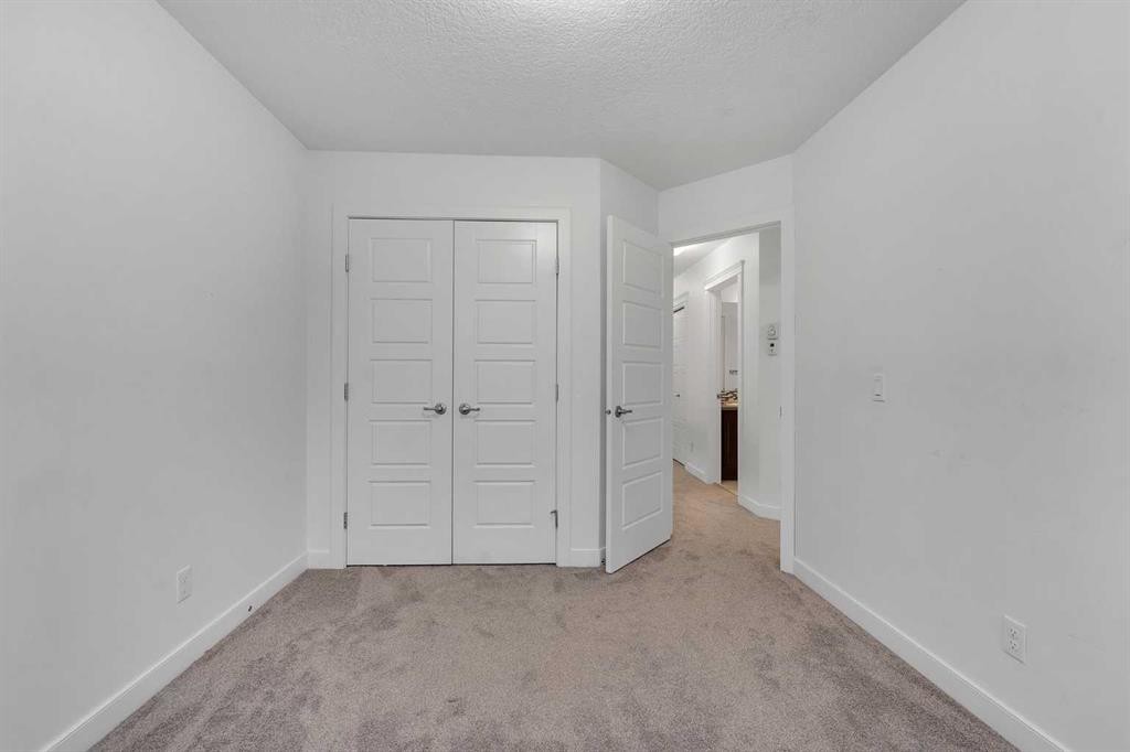 9 Redstone Common Ne, Calgary, AB - Indoor Photo Showing Other Room