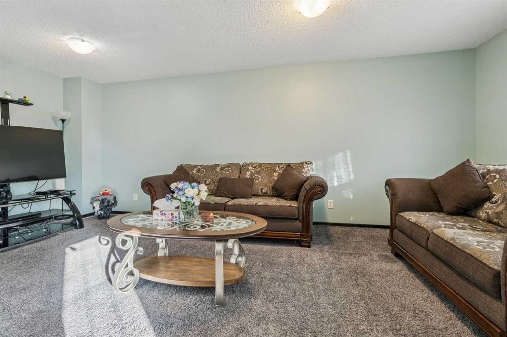 110 Eversyde Common Sw, Calgary, AB - Indoor Photo Showing Living Room