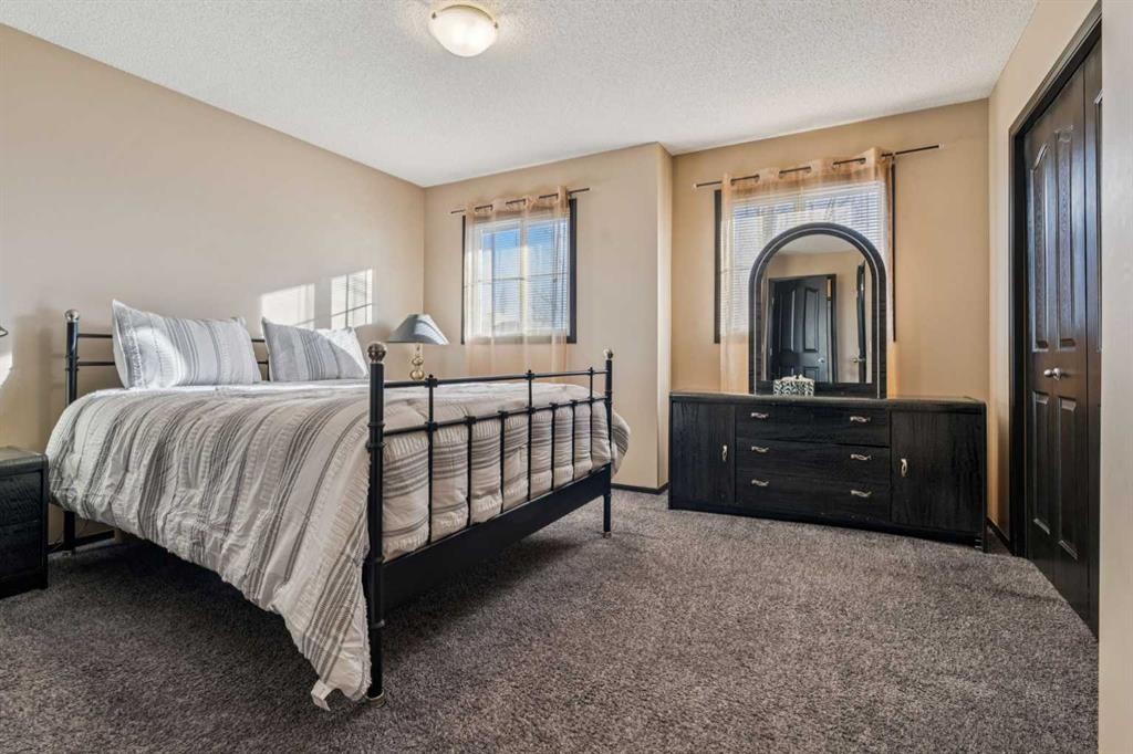 110 Eversyde Common Sw, Calgary, AB - Indoor Photo Showing Bedroom
