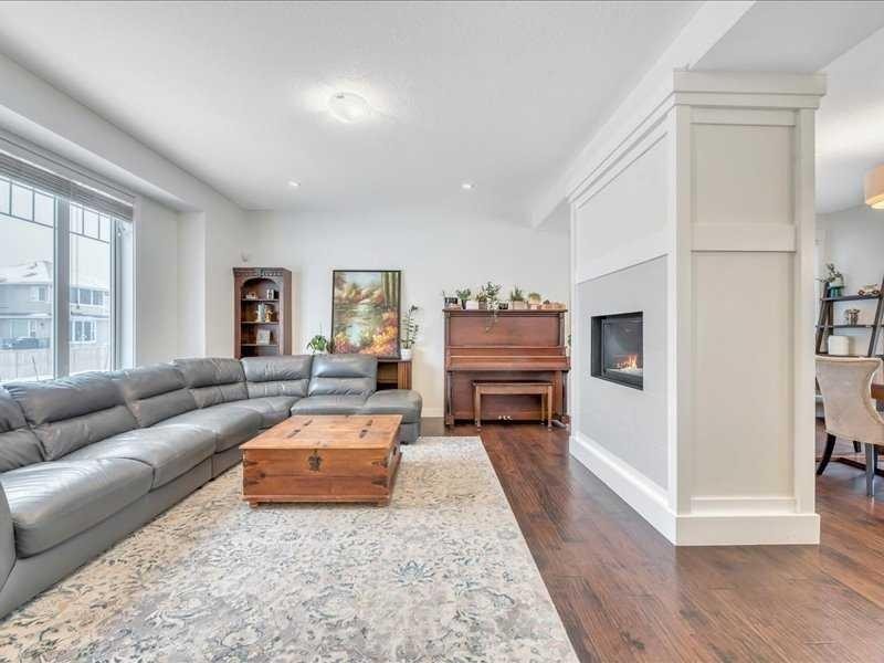 201 Rainbow Falls Glen, Chestermere, AB - Indoor Photo Showing Living Room With Fireplace