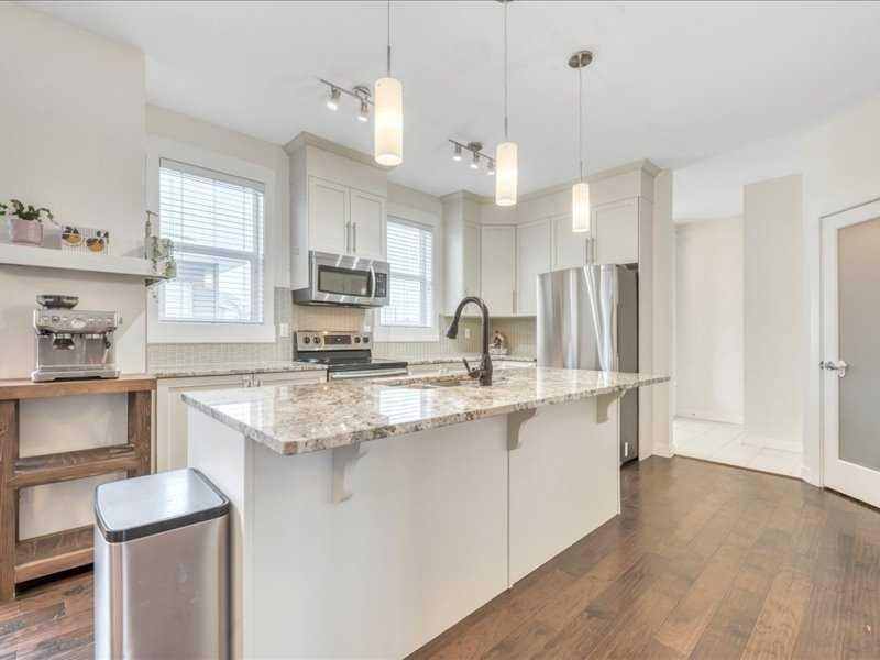 201 Rainbow Falls Glen, Chestermere, AB - Indoor Photo Showing Kitchen With Upgraded Kitchen