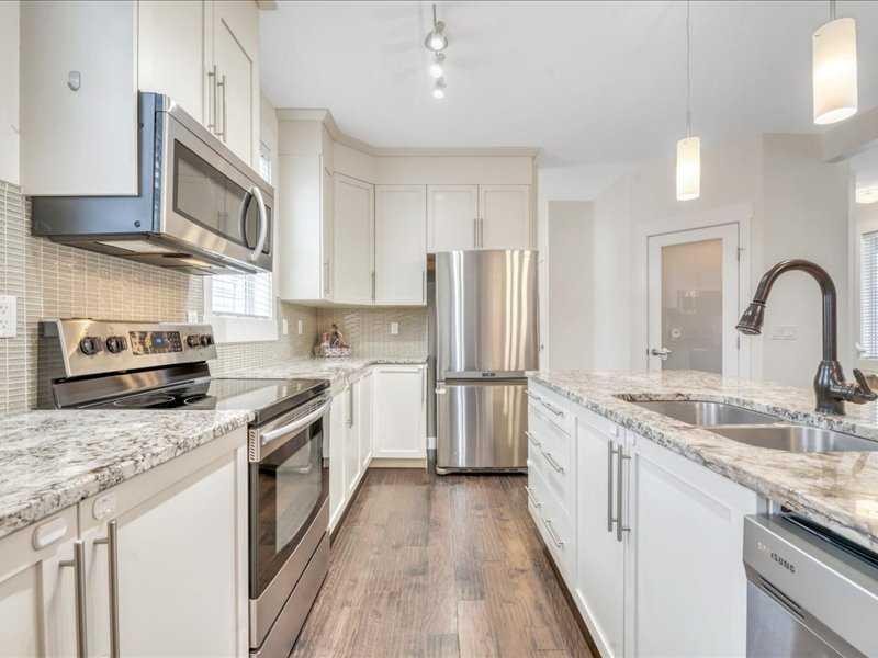 201 Rainbow Falls Glen, Chestermere, AB - Indoor Photo Showing Kitchen With Stainless Steel Kitchen With Double Sink With Upgraded Kitchen