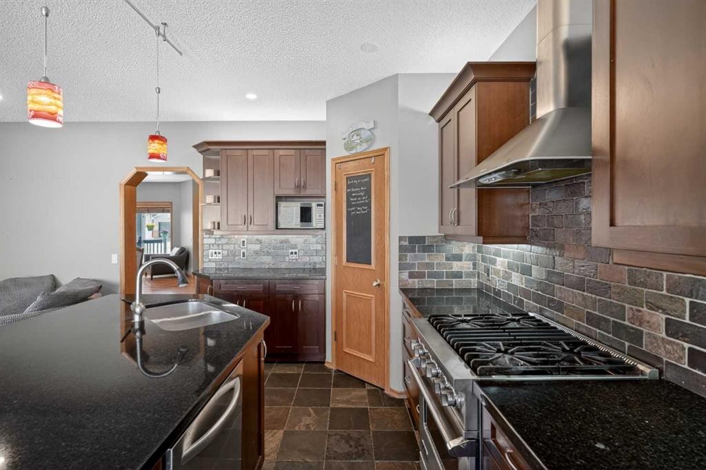 81 Riverwood Crescent Se, Calgary, AB - Indoor Photo Showing Kitchen With Double Sink