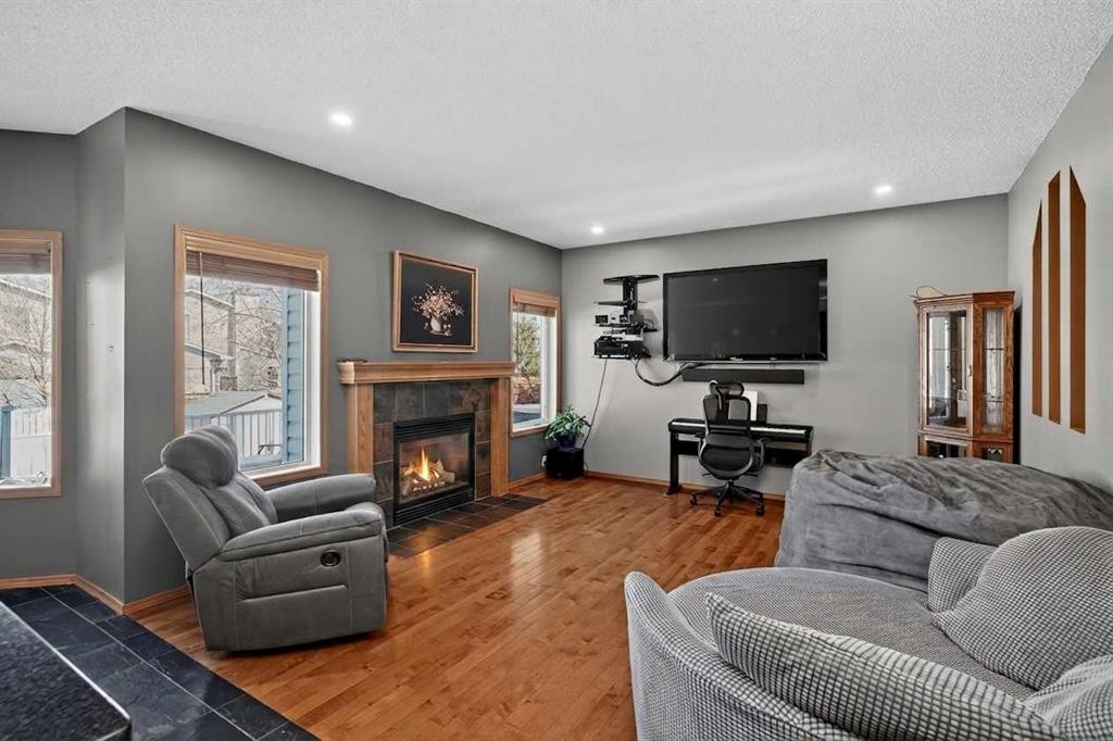 81 Riverwood Crescent Se, Calgary, AB - Indoor Photo Showing Living Room With Fireplace