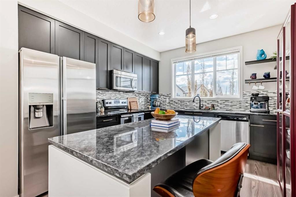113 Copperpond Row Se, Calgary, AB - Indoor Photo Showing Kitchen With Stainless Steel Kitchen With Upgraded Kitchen