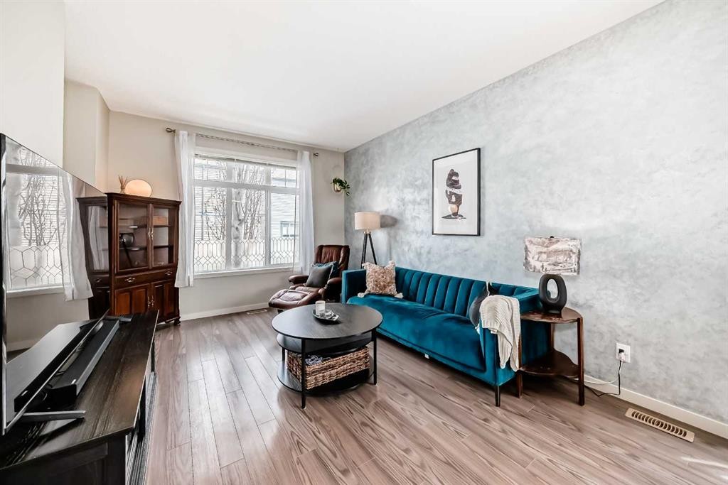 113 Copperpond Row Se, Calgary, AB - Indoor Photo Showing Living Room