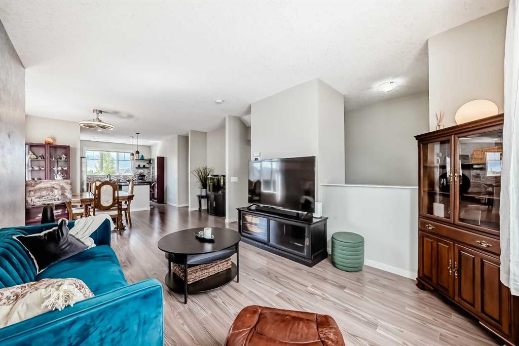 113 Copperpond Row Se, Calgary, AB - Indoor Photo Showing Living Room