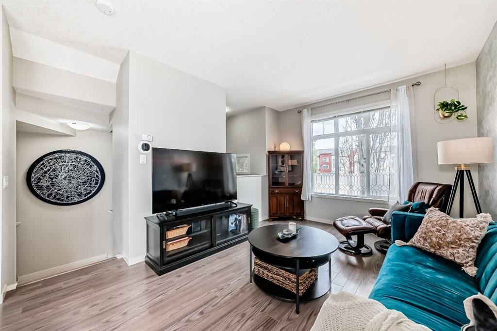 113 Copperpond Row Se, Calgary, AB - Indoor Photo Showing Living Room