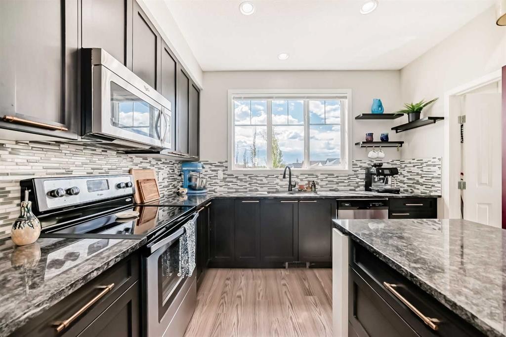 113 Copperpond Row Se, Calgary, AB - Indoor Photo Showing Kitchen With Upgraded Kitchen