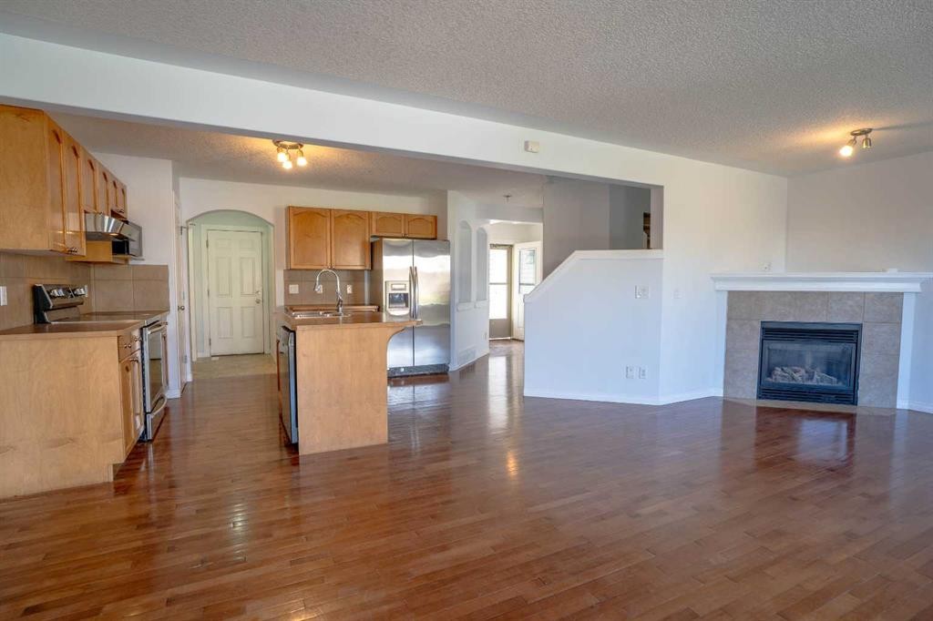 160 Covemeadow Road Ne, Calgary, AB - Indoor Photo Showing Kitchen With Fireplace