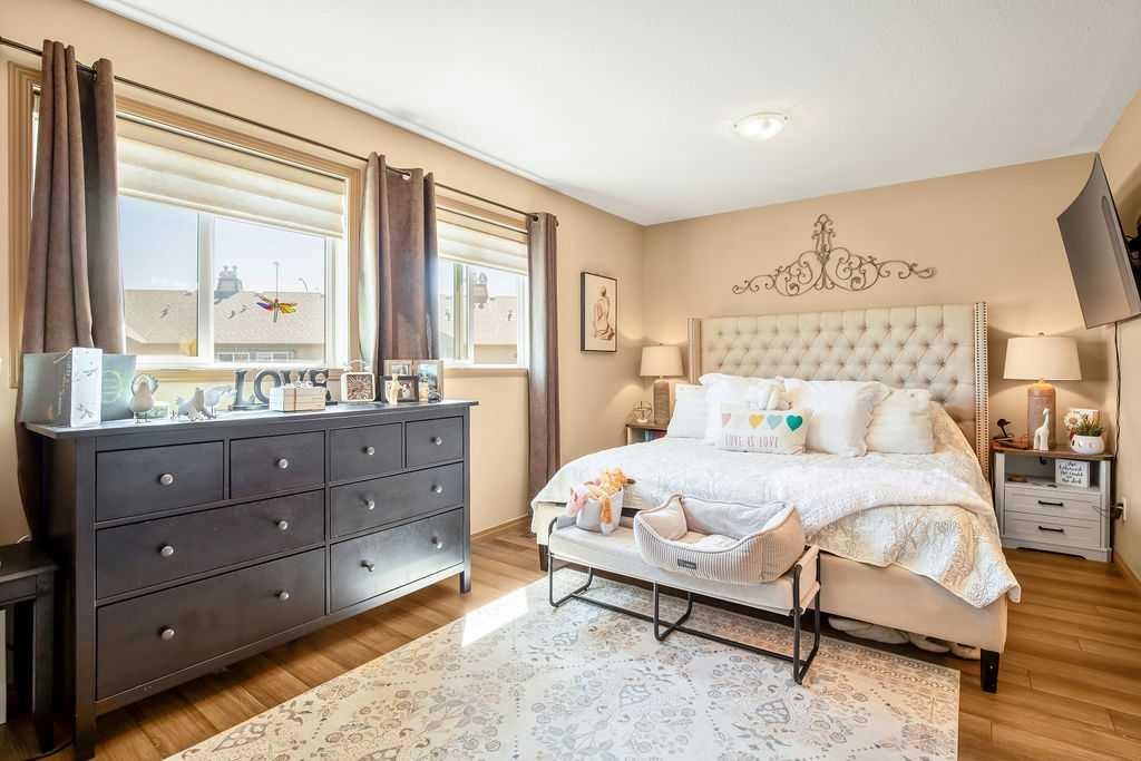 49 Spring Meadows Bay, Okotoks, AB - Indoor Photo Showing Bedroom