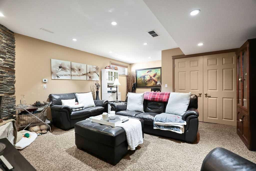49 Spring Meadows Bay, Okotoks, AB - Indoor Photo Showing Living Room