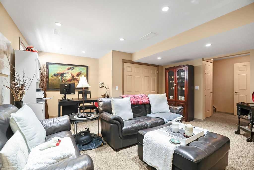 49 Spring Meadows Bay, Okotoks, AB - Indoor Photo Showing Other Room