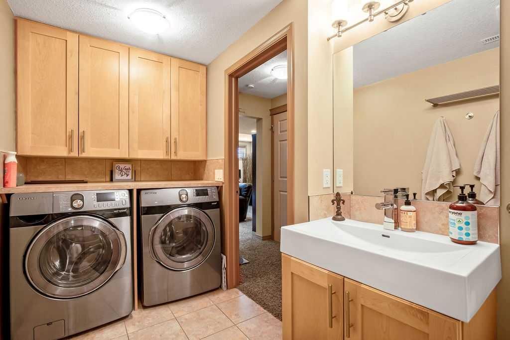49 Spring Meadows Bay, Okotoks, AB - Indoor Photo Showing Laundry Room