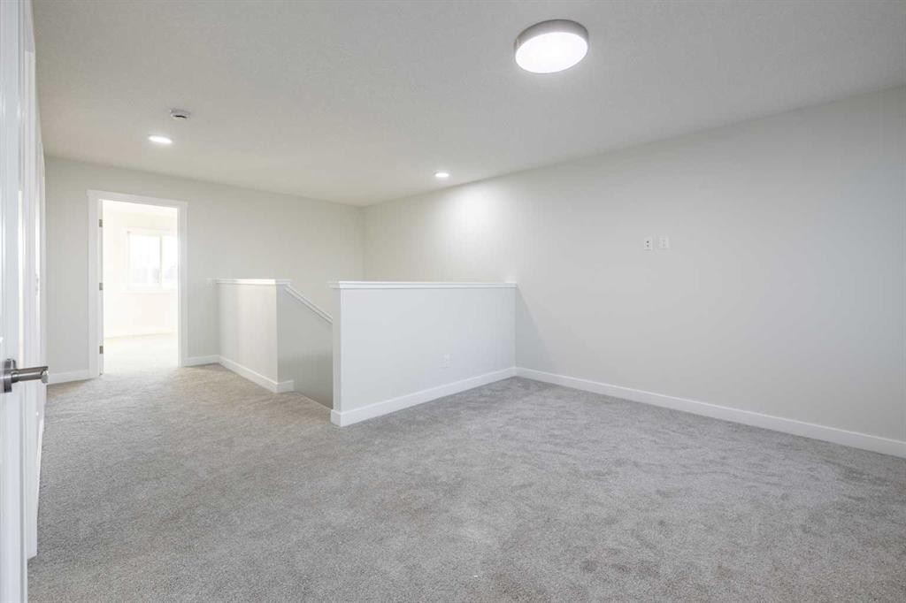 385 Sora Park Se, Calgary, AB - Indoor Photo Showing Other Room