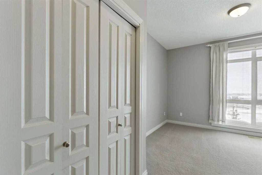 14-133 Rockyledge View Nw, Calgary, AB - Indoor Photo Showing Other Room