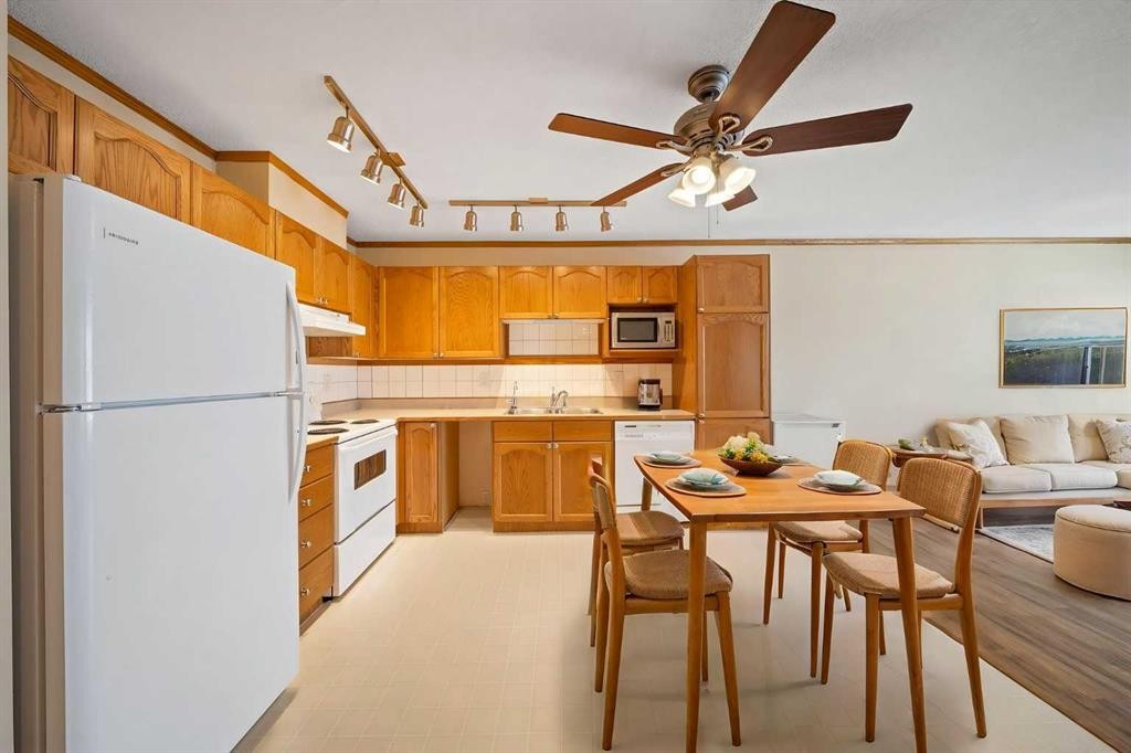 310-11 Somervale View Sw, Calgary, AB - Indoor Photo Showing Kitchen With Double Sink