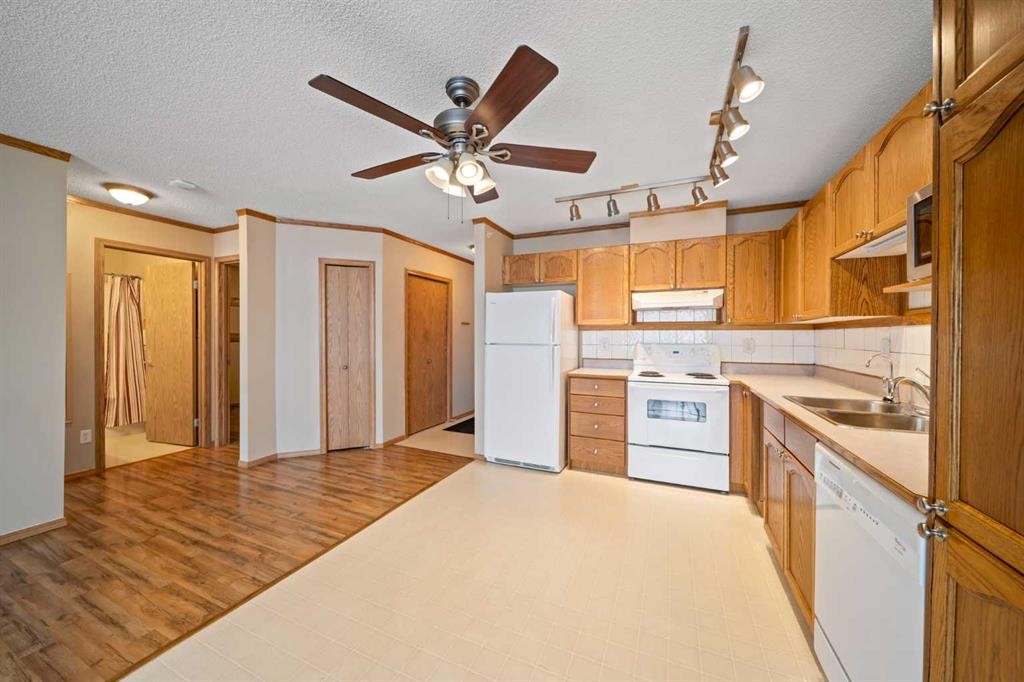 310-11 Somervale View Sw, Calgary, AB - Indoor Photo Showing Kitchen With Double Sink