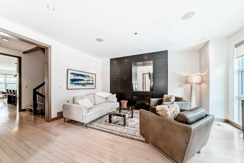 701 Aspen Meadows Hill Sw, Calgary, AB - Indoor Photo Showing Living Room With Fireplace