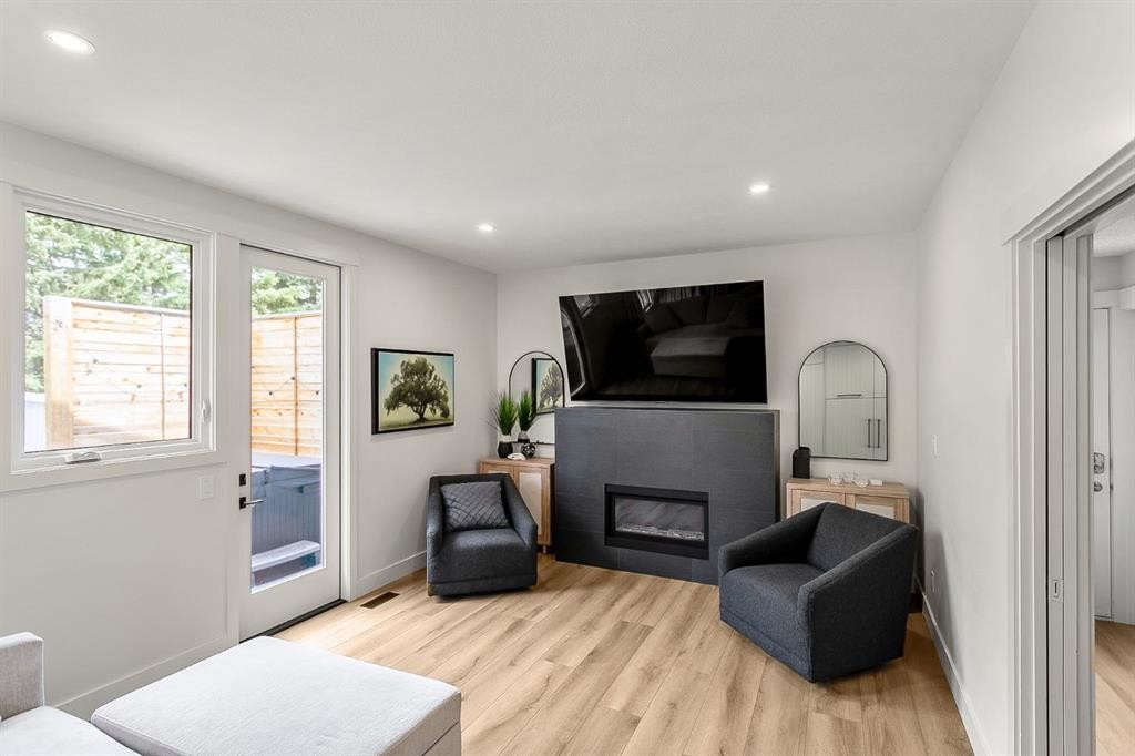 75 Woodacres Crescent Sw, Calgary, AB - Indoor Photo Showing Living Room With Fireplace