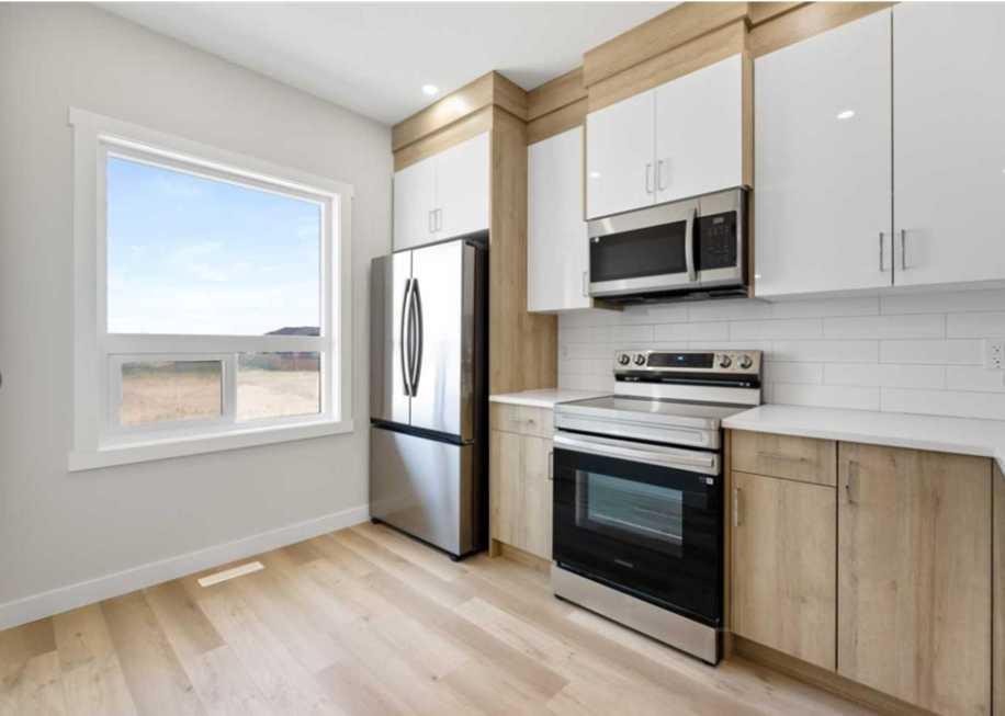 314-52 Red Sky Villas Ne, Calgary, AB - Indoor Photo Showing Kitchen With Stainless Steel Kitchen